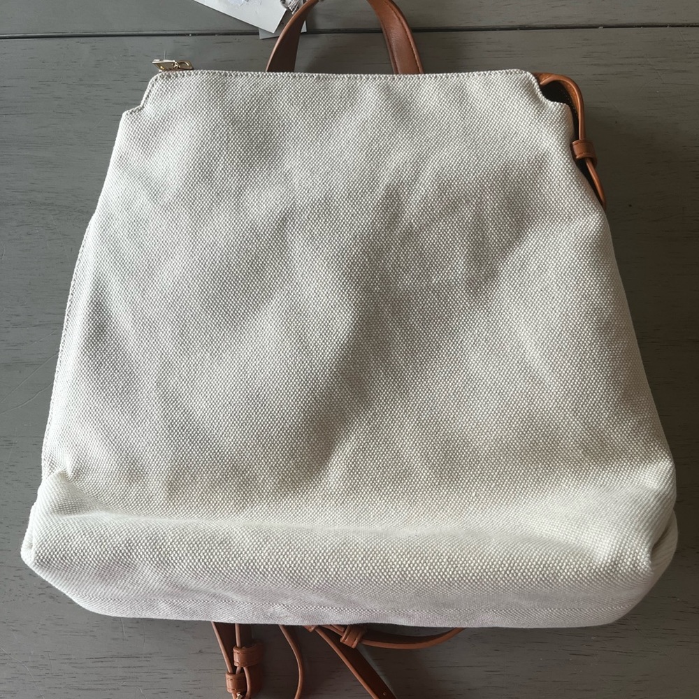 A NEW DAY CREAM AND BROWN BACKPACK